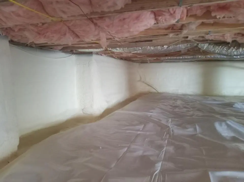 Crawl space encapsulation with closed-cell spray foam for Commercial Roof Restoration in Youngsville